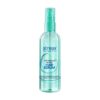 Streax Professional Vitariche Gloss Hair Serum enriched with Macadamia Oil and Vitamin E in a transparent pump bottle.